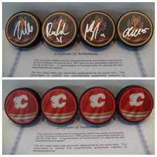 Calgary Flames 4 Signed Pucks Zadorov Andersson Backlund Jacob Markstrom COA