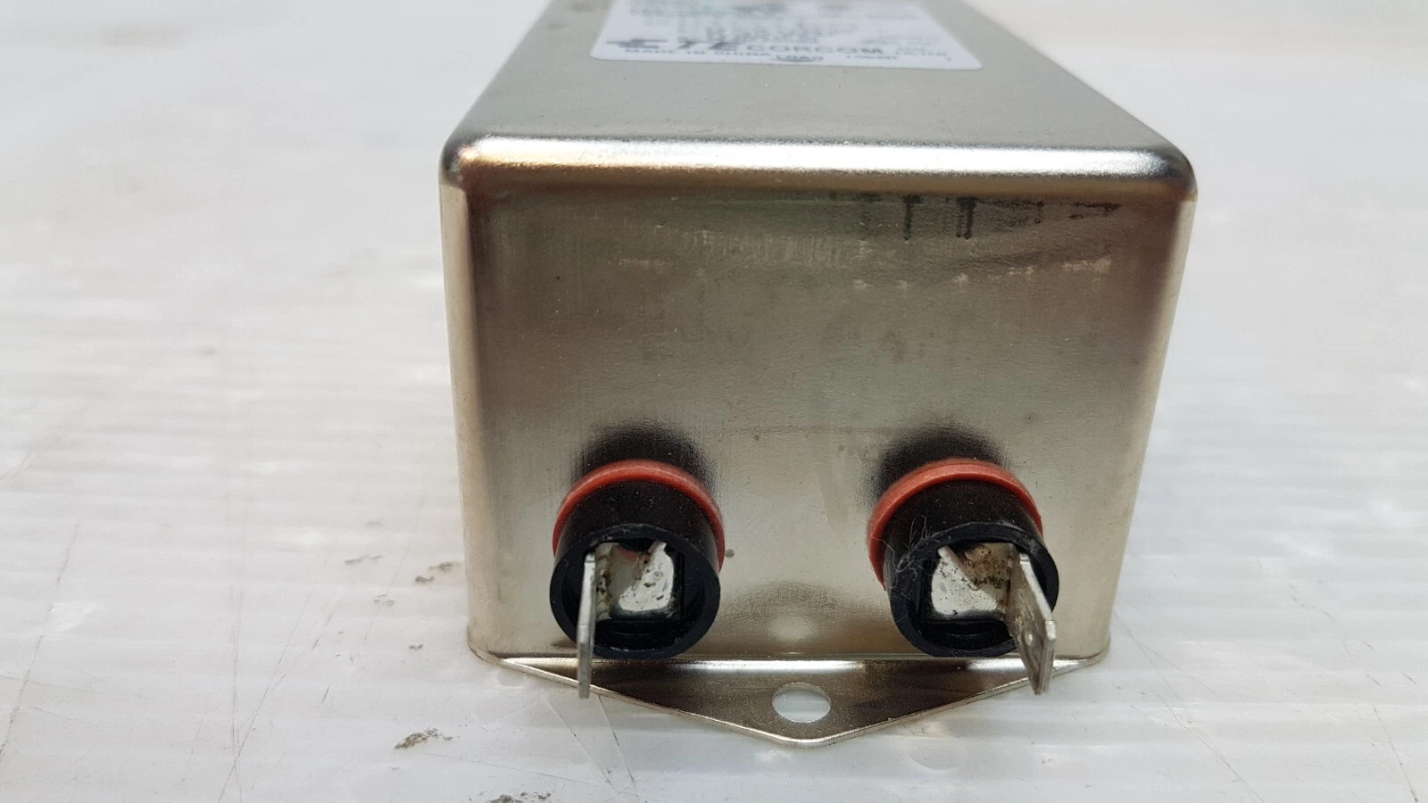Opposite end of the Corcom 16EQ1 filter with two quick-connect tabs