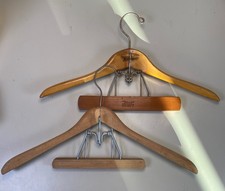 Two wooden Vintage Chicago clamp suit hangers