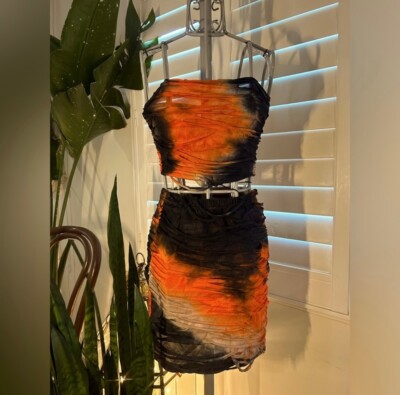 Black and orange set consisting of crop top and skirt; size small | Worn only on