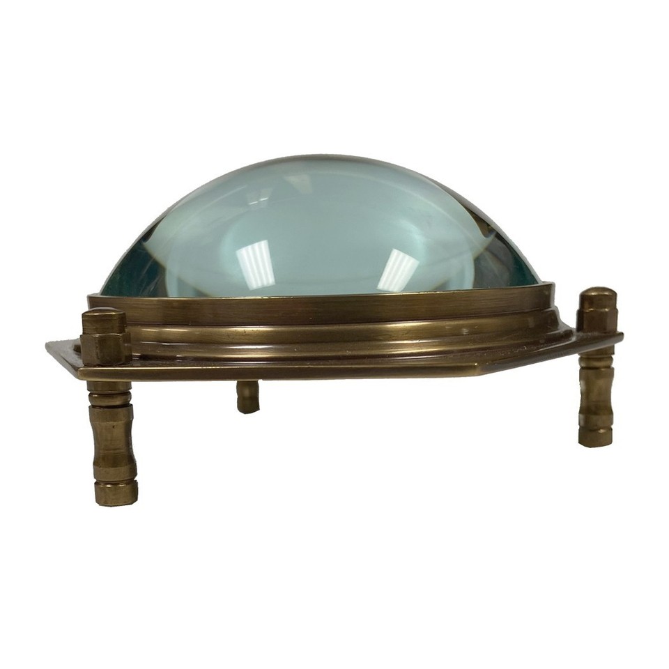 A beautifully crafted antiqued brass hexagonal dome magnifier that looks like it belongs on a 19th-century scholar's desk — practical and visually striking.