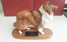 A BESWICK COLLIE ( rough) DOG ON A WOODEN PLINTH 21CM HIGH AND 24.5CM LONG