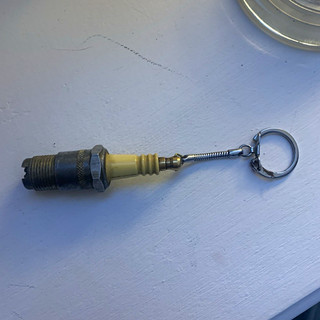 Vintage lighter spark plug bottom screws out and is a striker flint working orde