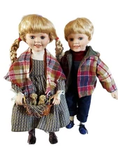 Pair Of Unmarked Porcelain Dolls
