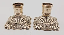 A PAIR OF ANTIQUE  LOADED-SILVER DWARF CANDLESTICKS, BIRMINGHAM 1911