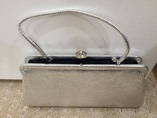 Vintage Silver metallic vinyl clutch purse w/ handstrap, Fully lined.