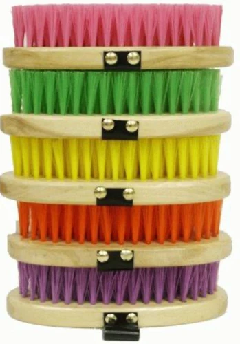 Cowboy brushes with stiff bristles on an oval base with hand strap