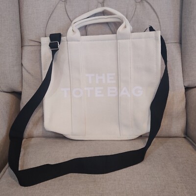 The Tote Bage Canvas Crossbody Large Light Beige Black Straps White Letters NWOT