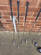 used set of golf clubs featuring an Accudyne branded driver And Dunlop Clubs
