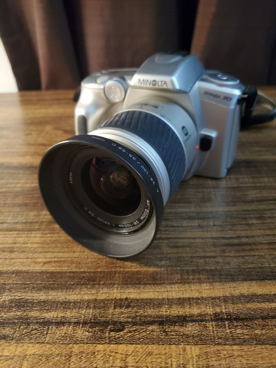 Silver Minolta Dynax 30 Film Camera with AF 28-100mm Minolta Silver Minolta Dynax 30 Film Camera with AF 28-100mm Minolta