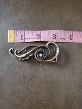 Vintage IsIs Brass Belt Buckle With Music Note Design.