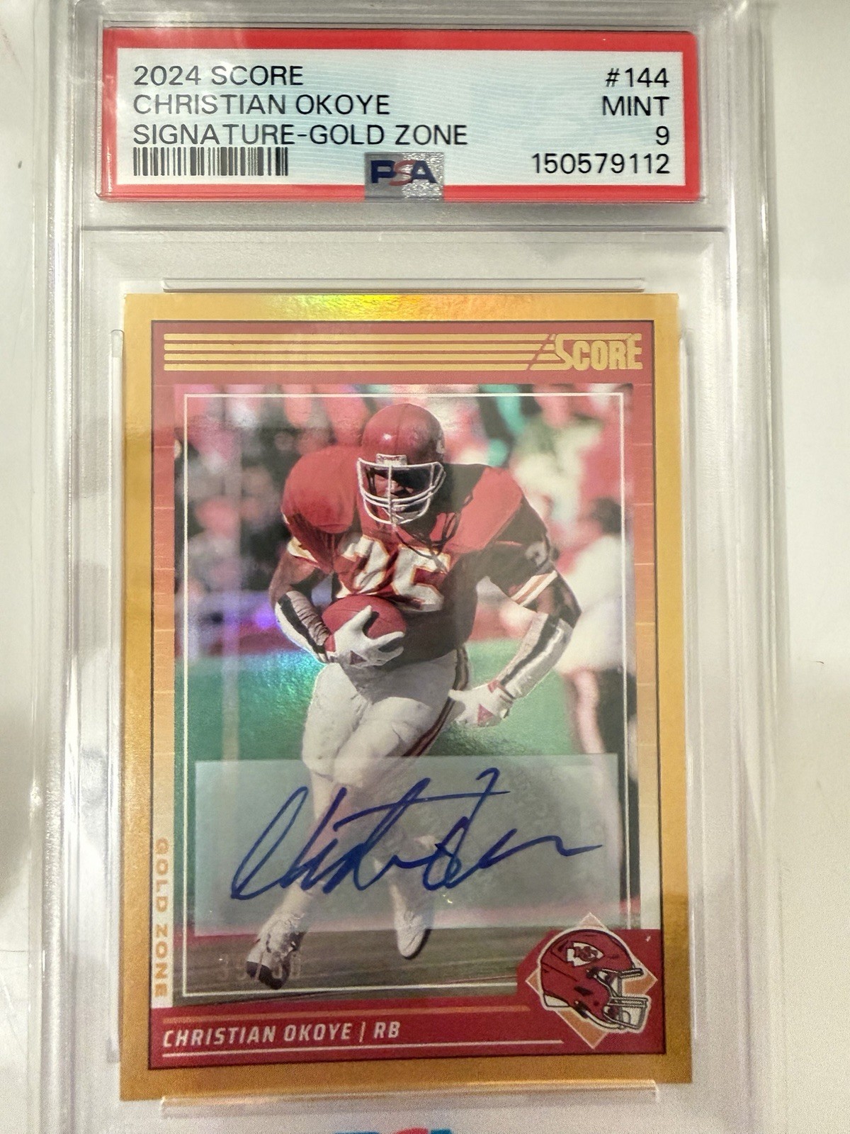 2024 Panini Score Football Autograph Gold Zone Christian Okoye 39/ 50 #144 PSA 9