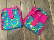 SwimSchool adjustable Fabric Arm Floats pink and aqua dolphin swimmies 40-55lbs