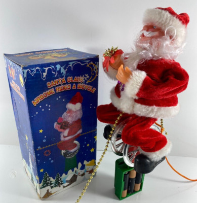 Vintage Santa Claus AirBome Rides A Bicycle Toy Figurine w/Video
