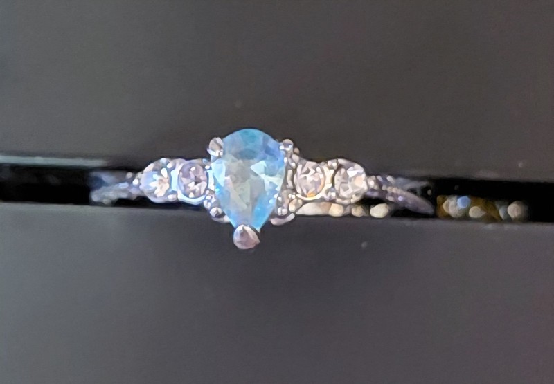 Fashion Ring With Blue Stone And Two Small White Stones On Either Side. Size 7