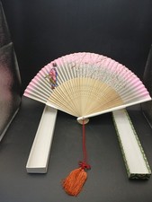 Pink fan with Geisha and Sakura flowers design.