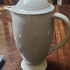 Fiesta Ceramic Beige Glossy Pottery Solid Pattern Round Lidded Pitcher with Lid
