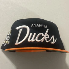 Mitchell & Ness Anaheim Ducks Team Pin Black/Orange Adjustable Snapback Hat Cap