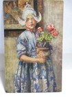 1910 RAPHAEL TUCK POSTCARD PICTORIAL HOLLAND, DUTCH GIRL HOLDING FLOWERS — photo 1