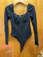 Women "Wild Fable" black, long sleeve one piece body suit . Size Med. Prev. Owne