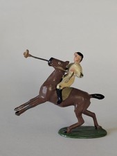 Hand-painted metal/lead miniature figurine depicting a polo player Germany