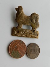 A VINTAGE METAL BADGE, 'THE TIBETAN SPANIEL ASSOCIATION'