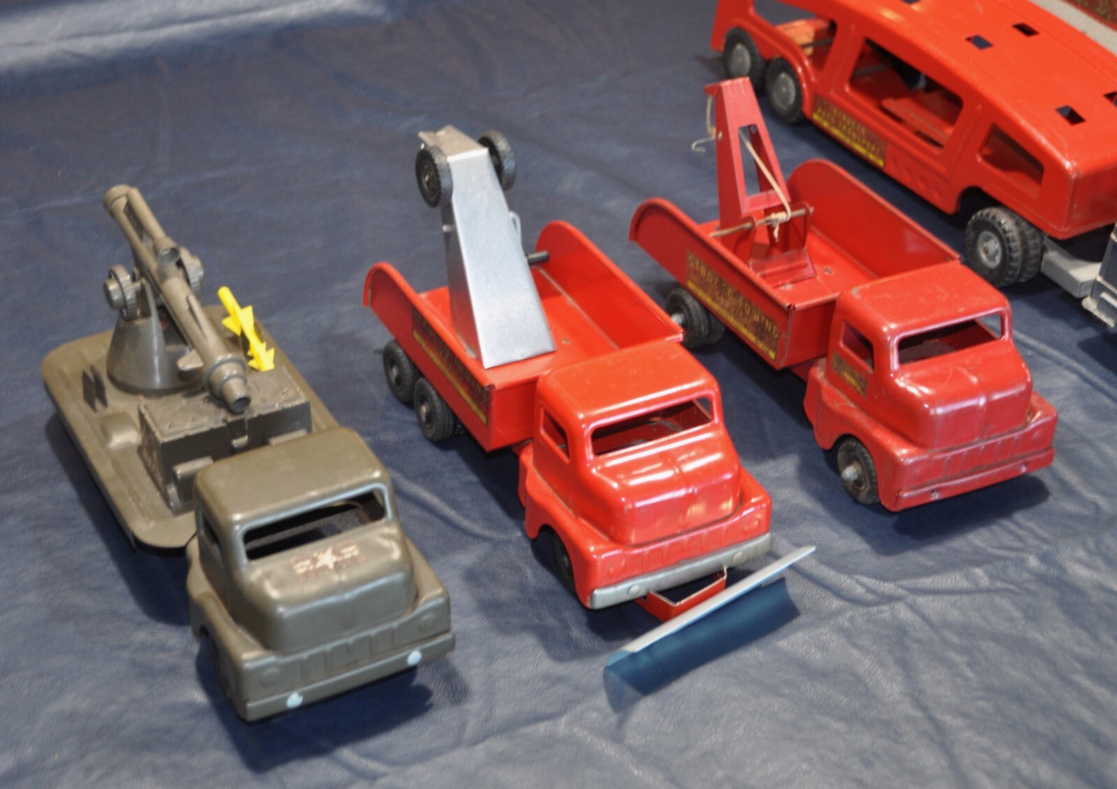 9 Vintage 1950's Structo Toy Trucks, good to very good condition for