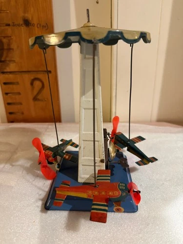 Antique Tin Litho Mechanical Wolverine Airplane Merry Go Round