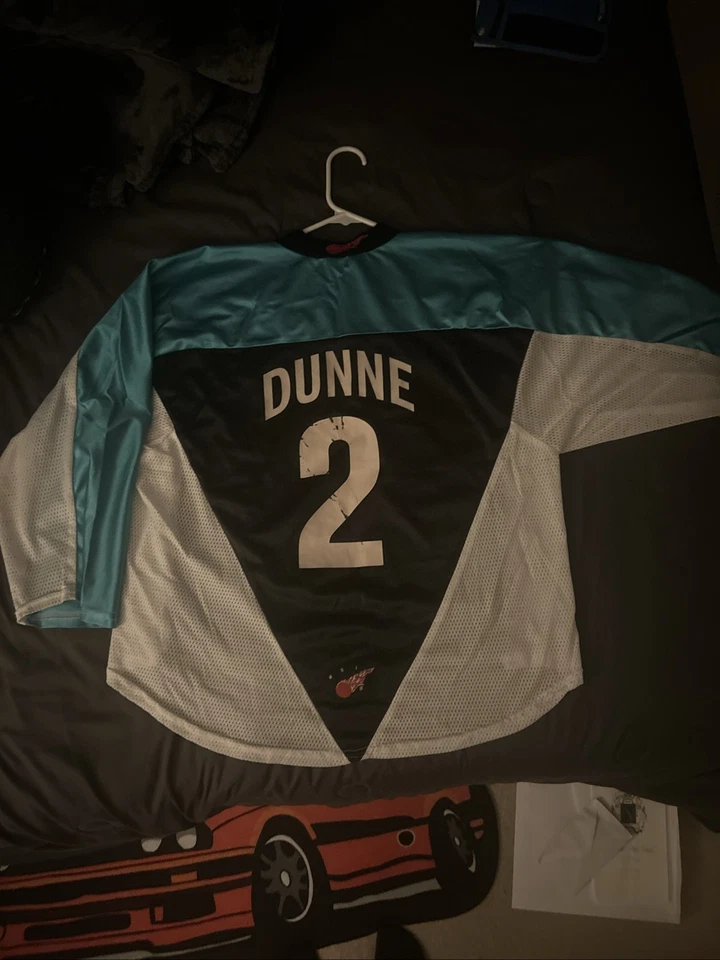 Camiseta de hockey azul blanco y negro cerdos campeonatos regionales de hockey en línea Foto 2 de 4