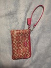 Coach L-Zip Wristlet In A Red Signature Canvas Pattern. Excellent Condition