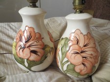 MOORCROFT HIBISCUS LAMPS  ON A CREAM GROUND A PAIR