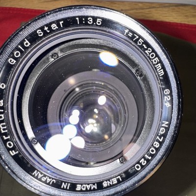 Camera lens, specifically a ''Formula 5 Gold Star f=75-205mm 1:3.5'' Zoom Lens