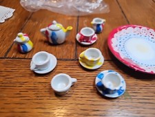 Vintage Miniature Porcelain Tea Set Hand Painted Designs.