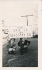 vintage snapshot photo: Roadside Erie Sandusky Ohio County Road Sign Boy Girl — photo 1