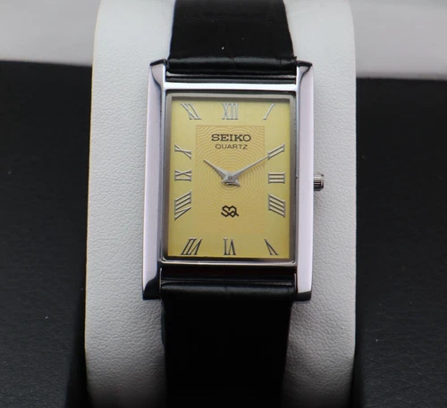Vintage Seiko Slim Quartz Men's Wrist Watch Yellow Dial with Black Strap.