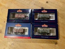 Rake of 4 Bachmann 7 Plank Wagons 37-2010K, 37-080K x2, 37-080W