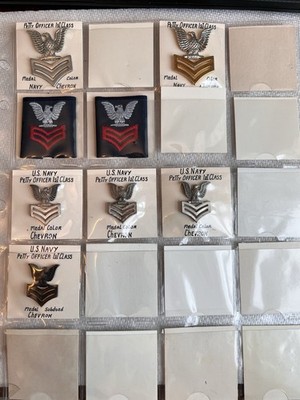 COLLECTION OF 8 US NAVY FIRST CLASS PETTY OFFICER DEVICES/PATCHES