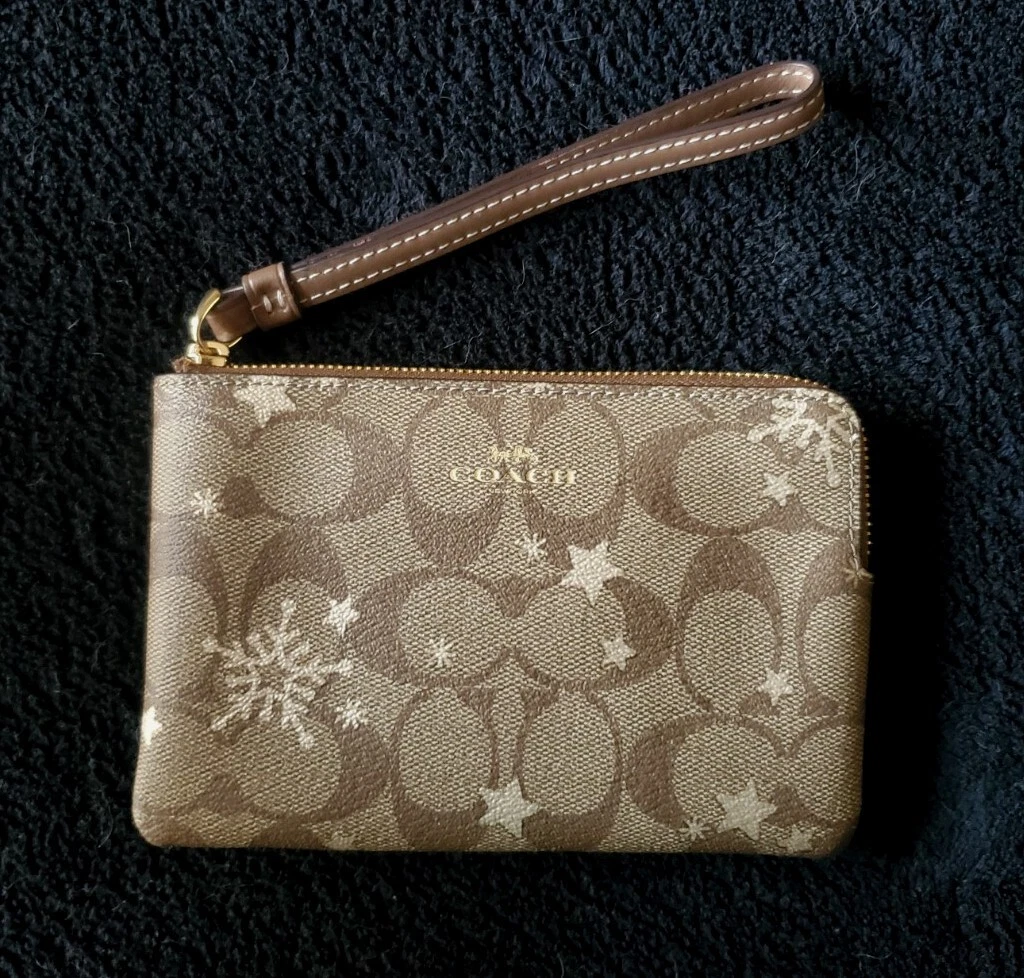 Portafoglio da polso COACH ad angolo cerniera firma tela star&Snowflake cachi oro nuovo con etichette