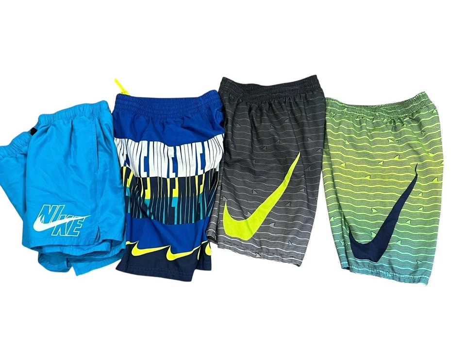 LOTE DE 4 PANTALONES CORTOS DE NATACIÓN NIKE PARA NIÑOS BAÑADORES LOGOTIPO GRÁFICO GRANDE 14-16 Foto 2 de 4