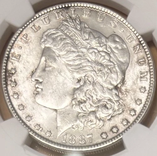 1887 Morgan Silver Dollar $1 - AU58 - NGC - Philadelphia