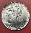 1986 American Silver Eagle (ASE) Dollar, Gem.  First Year Issue. Light Toning.