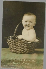 pk06284:Genuine Photograph Postcard- 'Arrived Here in Good Order' Baby & Basket