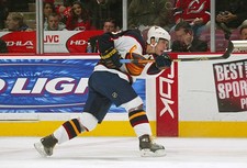 Slava Kozlov Atlanta Thrashers passes the puck at the game v- Ice Hockey Photo