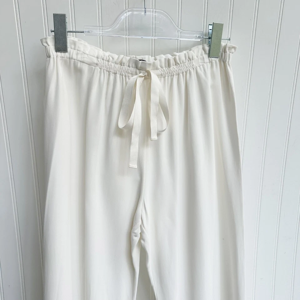 Pantalones de pierna recta relajados con cordón marfil The Row minimalistas de lujo pequeños Foto 3 de 4