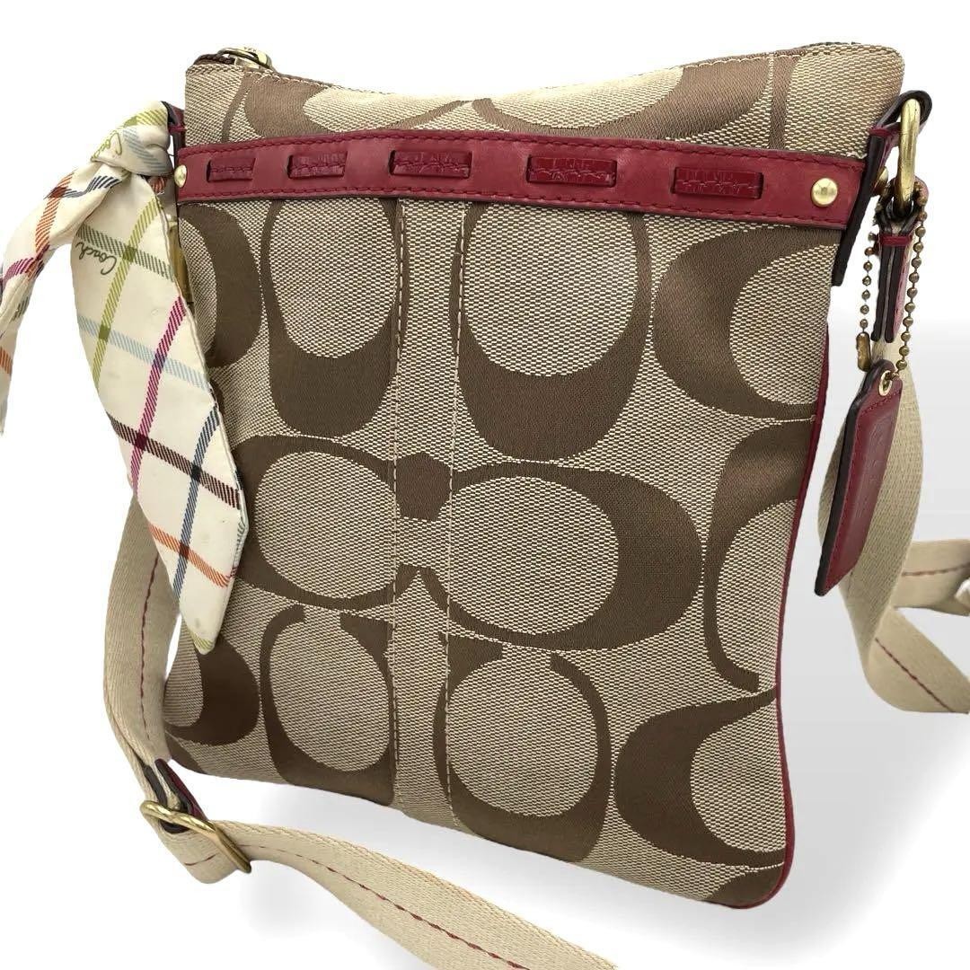 COACH beige canvas diagonal crossbody shoulder bag with bandana design