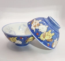 Excellent pair of Japanese Schen children's porcelain rice bowls w/ puppies