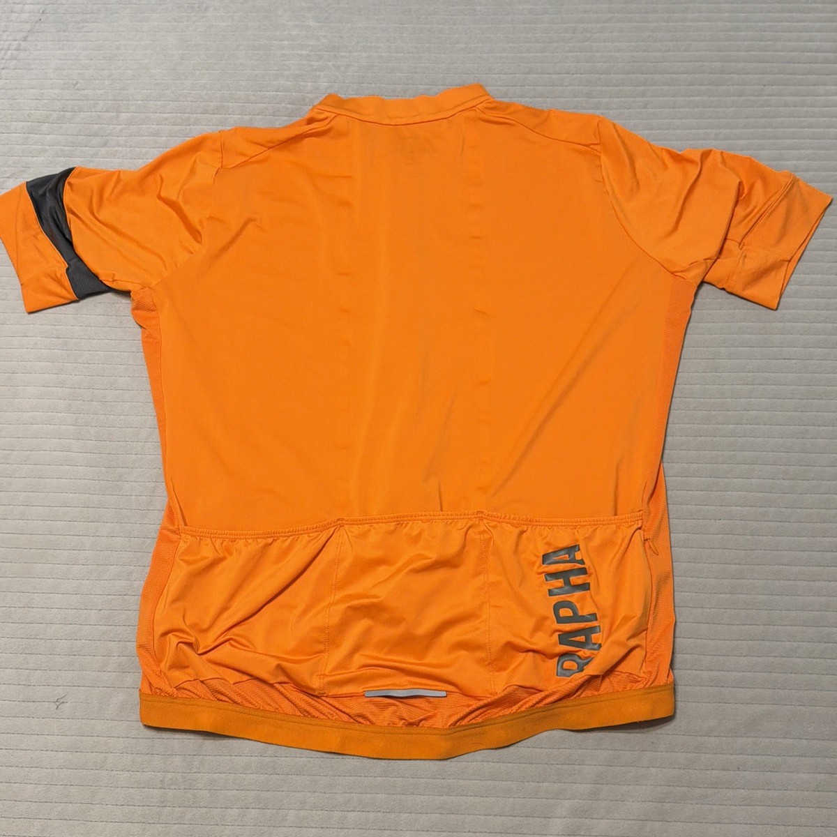 Rapha Pro Team Forcats de la Route Wind/Rain orange Jacket Womens