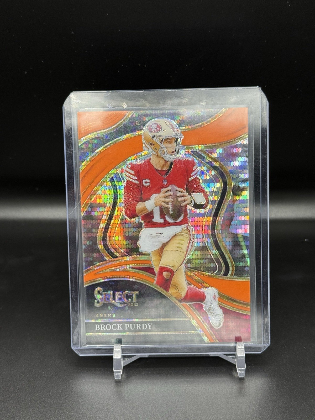2023 Panini Select Club Level Neon Orange Pulsar Prizm /7 Brock Purdy FOTL 49ers