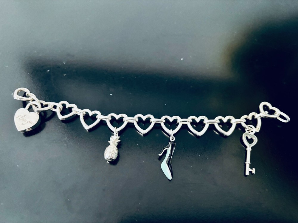 Tiffany Co adjustable multi heart bracelet with charms