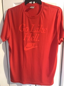 gray and red nike shirt
